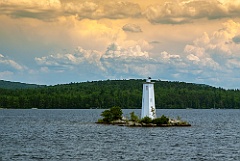 Billowing Clouds Over Loon Island Light on Lake Sunapee